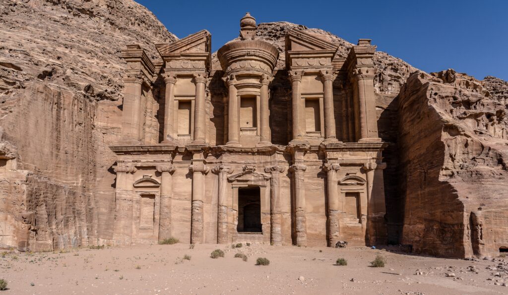 A closeup shot of an old building constructed on a cliff during daytime